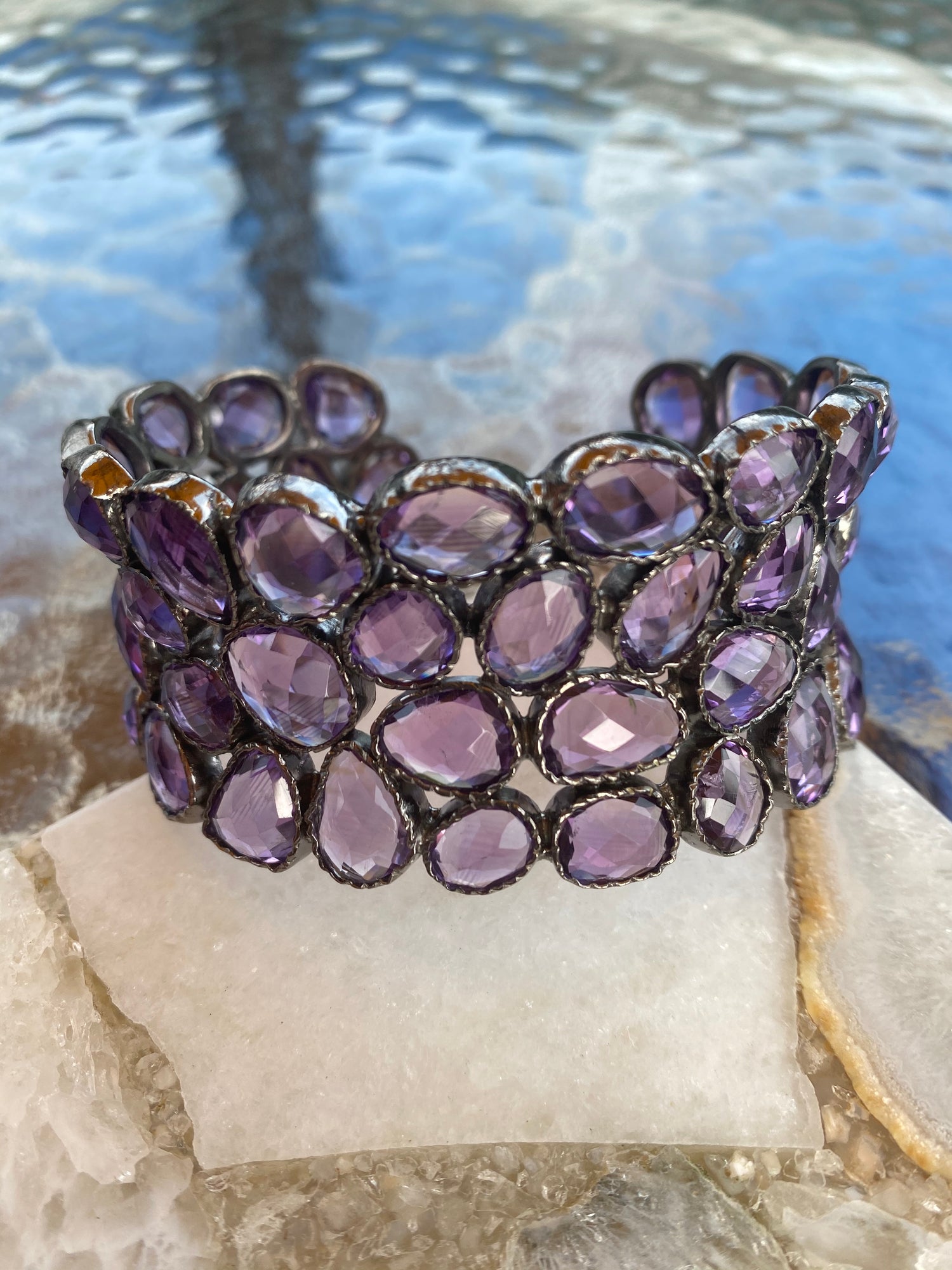 Detail view of Amethyst and Citrine and Topaz bracelet showing gemstone color and texture