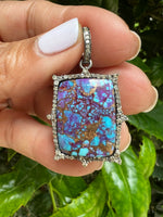 Detail view of Diamond and Turquoise jewelry showing gemstone color and texture